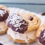 Mocha Coconut Caramel Ice Cream Sandwiches (on a white platter) are mocha coconut chocolate chip cookies with creamy caramel ice cream.